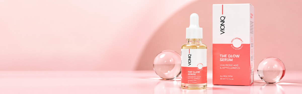 Glow serum bottle and product packaging in a soft studio setting